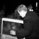 President John F. Kennedy enters his White House car after attending a showing of the movie “Spartacus” in a downtown theatre in Washington on February 3, 1961. (AP Photo/William J. Smith)